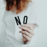 How to respond to negative feedback concept - woman showing no