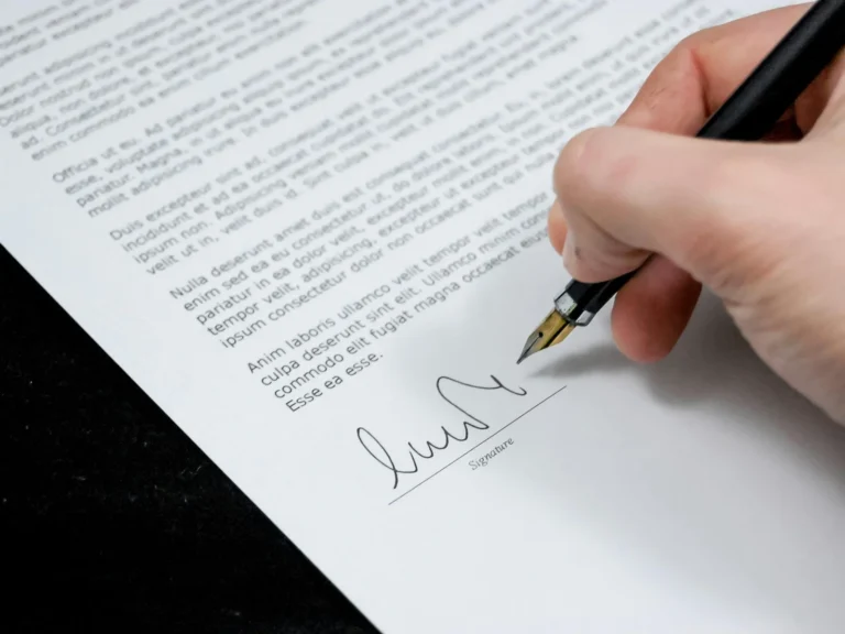 Selling business concept - signing papers on changing ownership